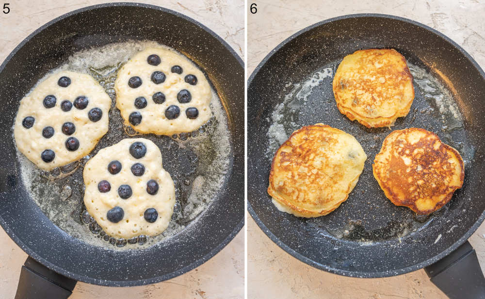 Blueberry pancakes in a pan. Pancaked are being cooked in a black pan.