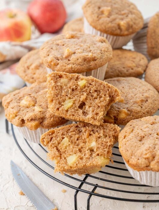 Healthy apple muffins on a black cooling rack.