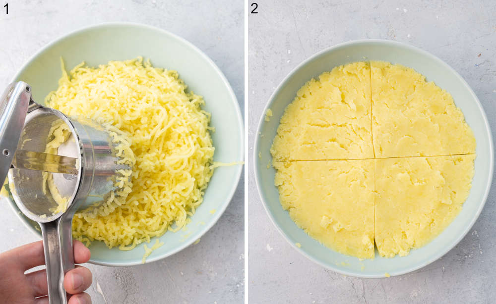 Cooked potatoes are being put through a potato ricer. Mashed potatoes divided in half in a bowl.