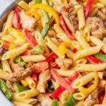 Jerk chicken pasta in a frying pan.