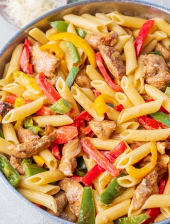 Jerk chicken pasta in a frying pan.