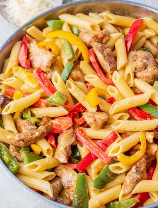 Jerk chicken pasta in a frying pan.