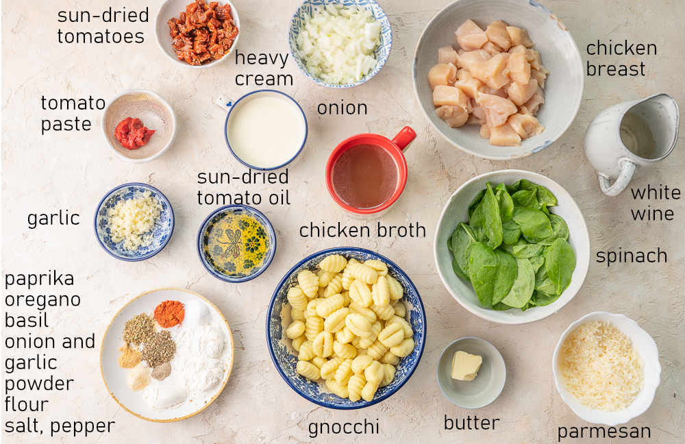 Labeled ingredients for creamy Tuscan chicken with gnocchi.