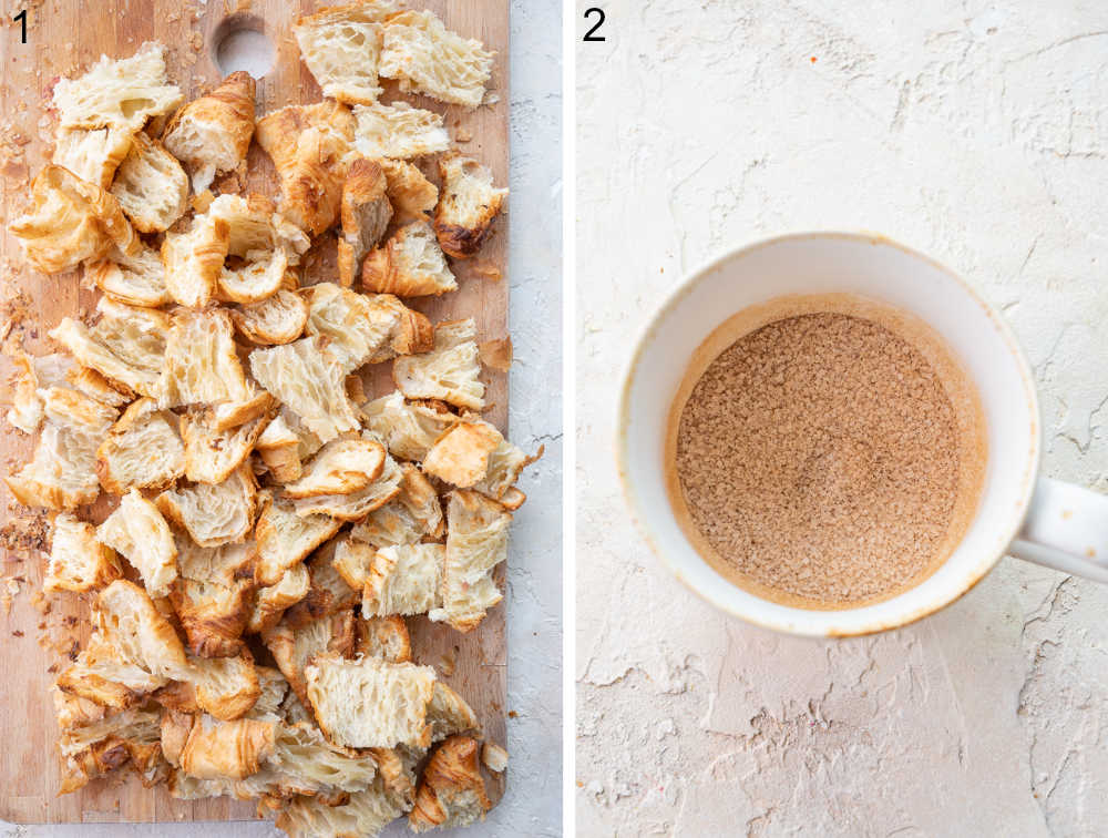 Croissants cut into cubes on a wooden board. Cinnamon sugar in a cup.