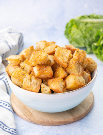 Homemade croutons in a blue bowl.