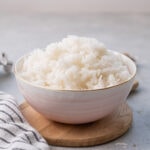 Cooked Jasmine rice in a pink bowl.