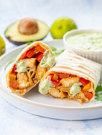 Chicken Fajita wraps on a white plate.