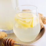 Lemon ginger water in a glass.
