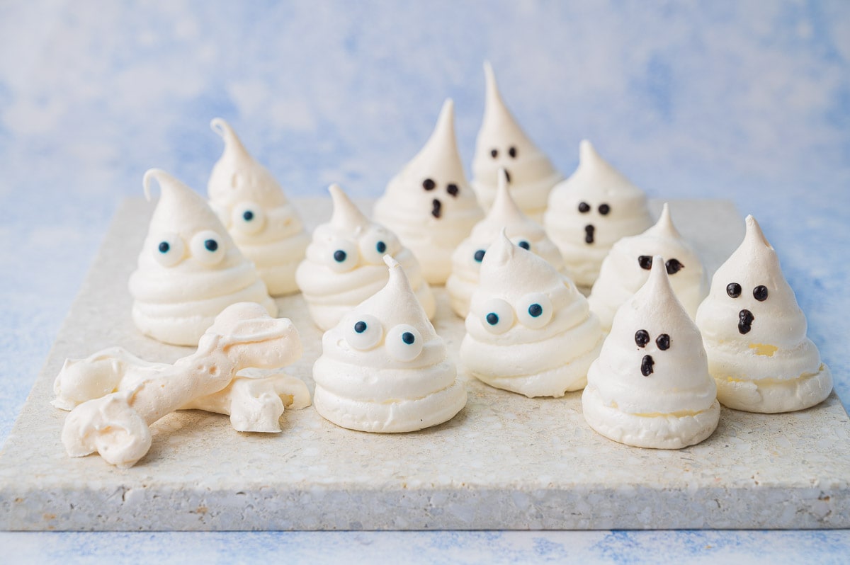 Meringue ghosts on a stone tray.