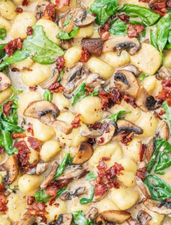 Mushroom gnocchi with spinach and bacon.
