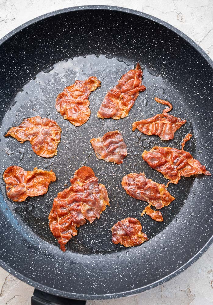 Crispy Prosciutto in a skillet.