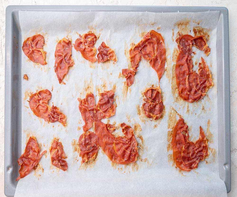 Crispy baked Prosciutto on a baking sheet.