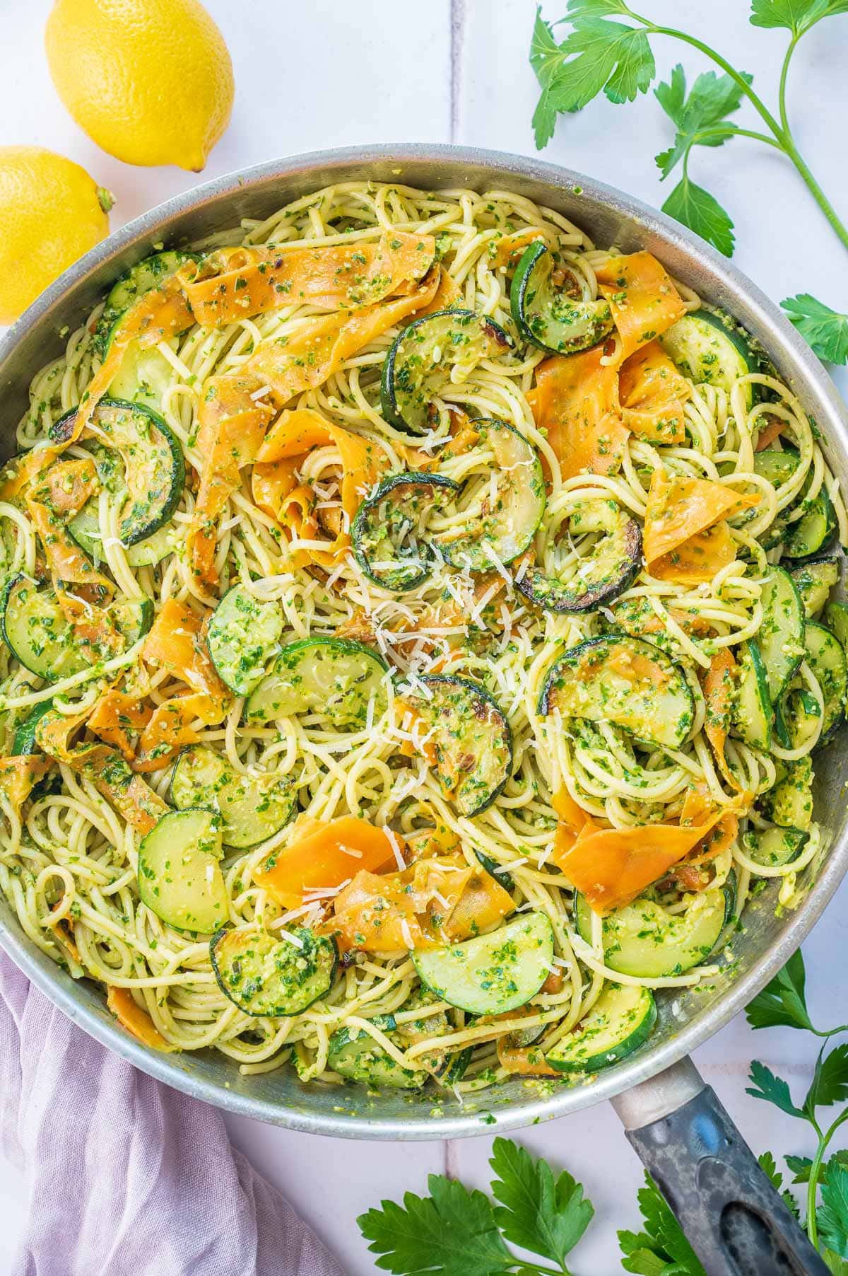 An overhead photo of parsley pesto pasta in a frying pan.