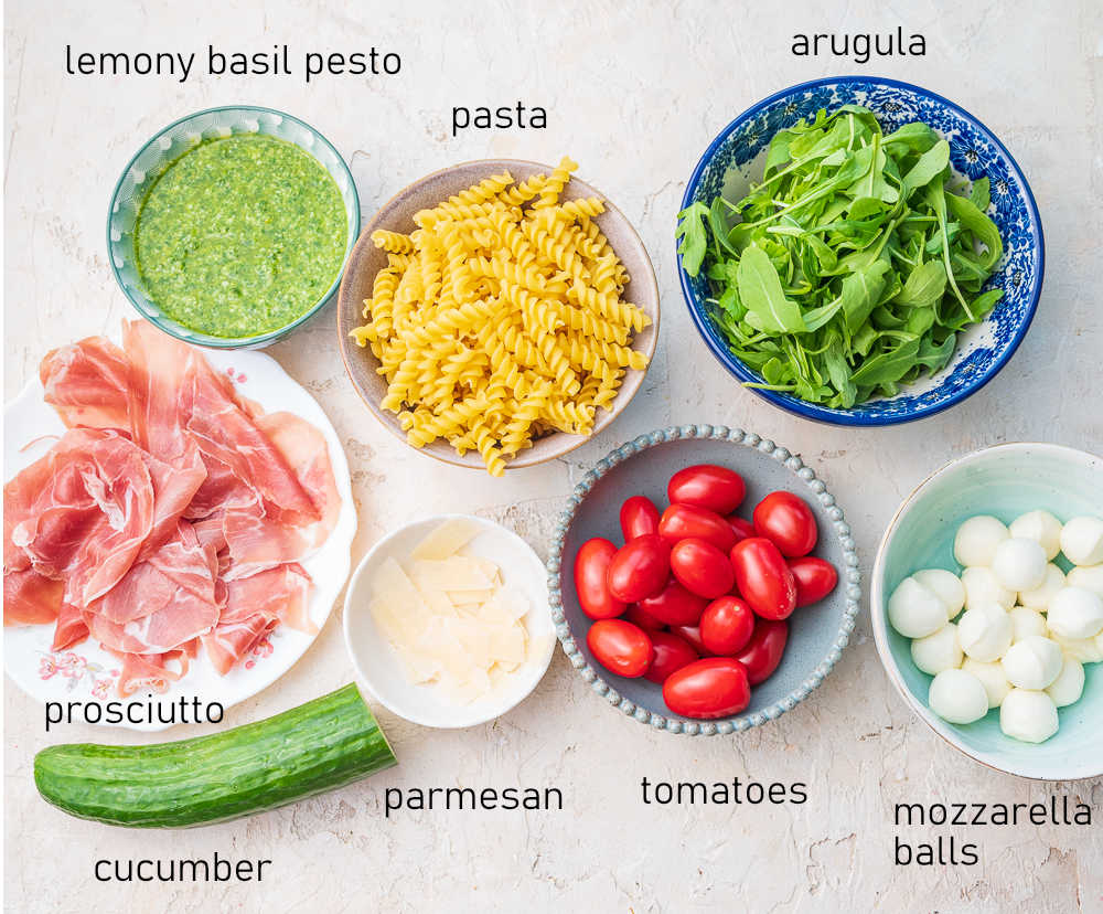 Labeled ingredients for pesto pasta salad.