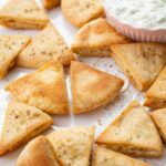 Pita chips on a white plate.