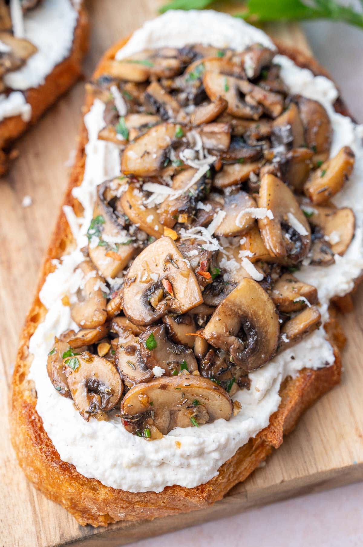 Mushroom toast on a wooden board.