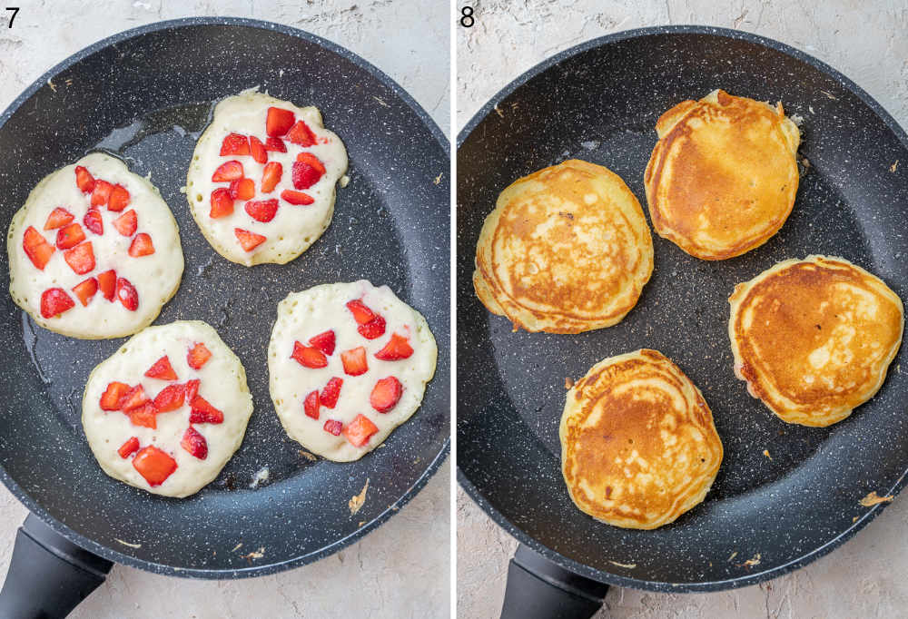 Strawberry pancakes are being cooked in a black pan.