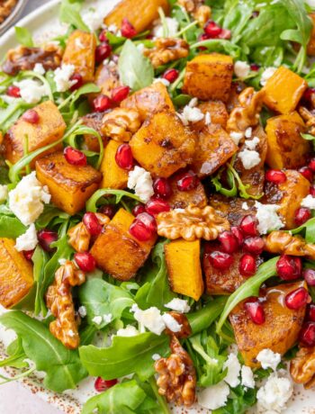 Toasted butternut squash salad on a white plate.