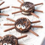 Oreo spiders on a white plate.