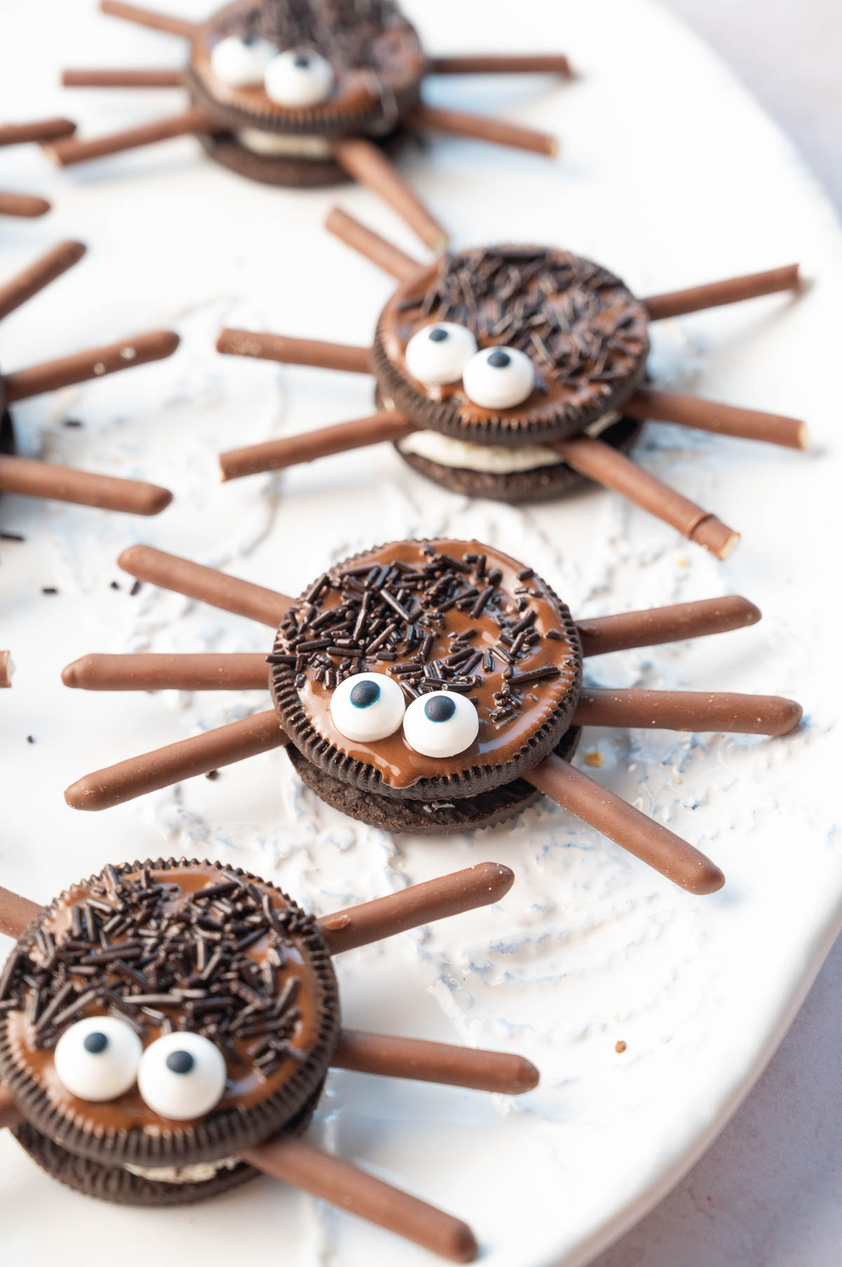 Oreo spiders on a white plate.