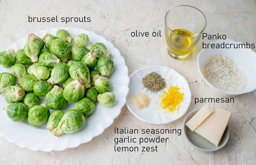 Labeled ingredients needed to prepare parmesan roasted brussel sprouts.