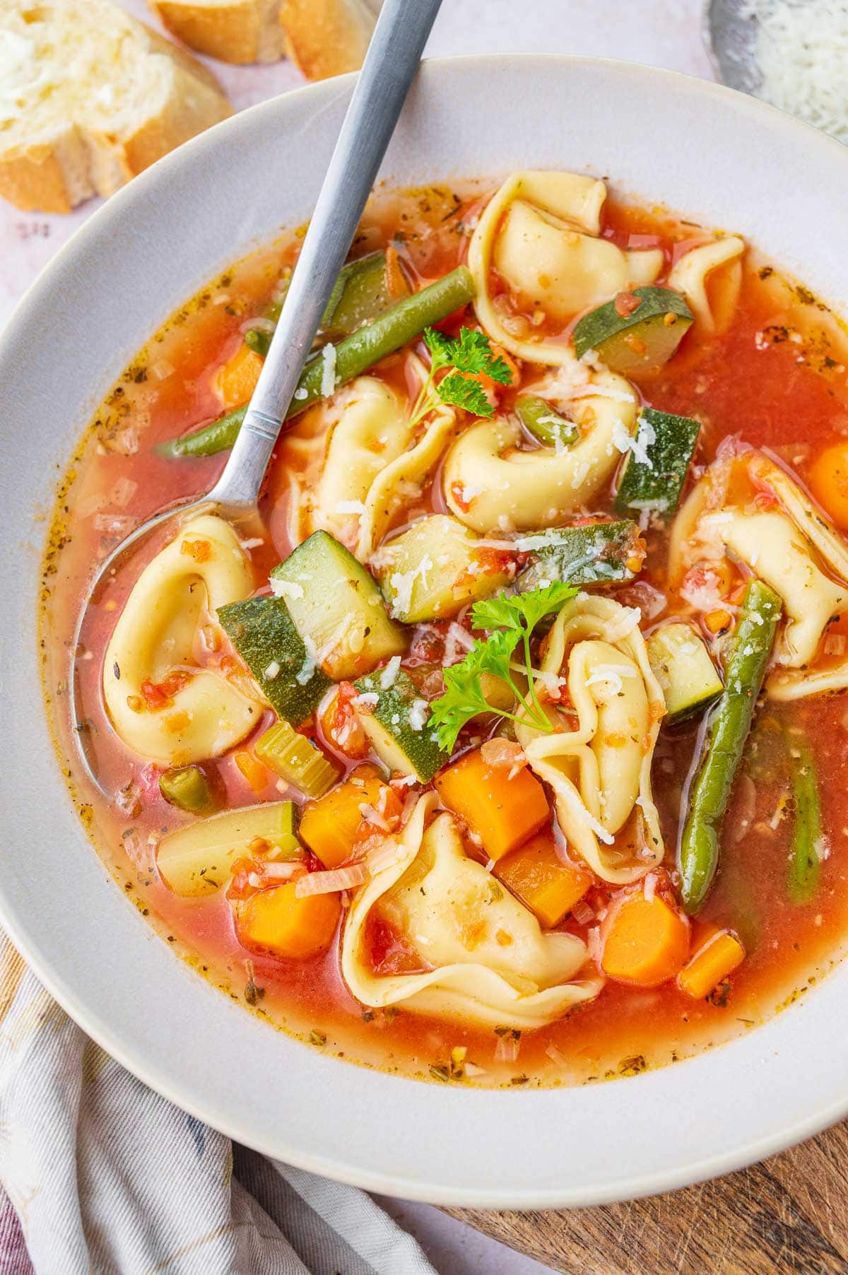 Vegetable tortellini soup in a bowl.