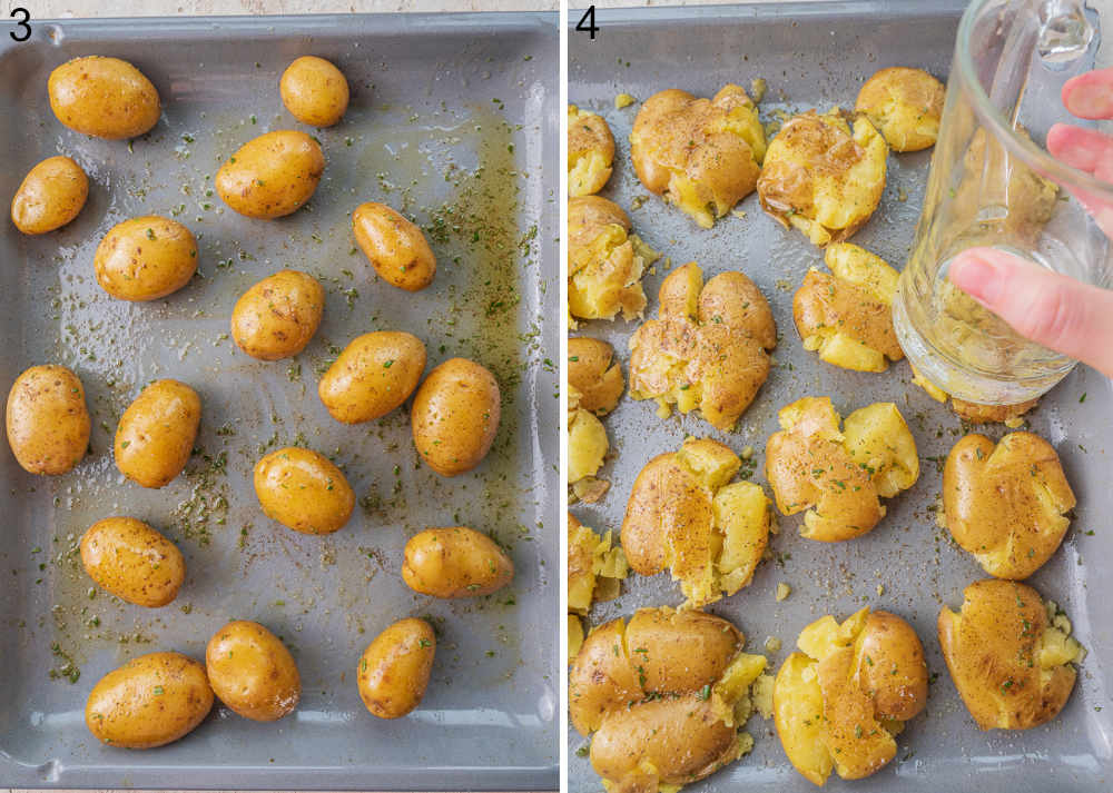 Potatoes tossed with olive oil on a baking sheet. Potatoes are being smashed with a cup.