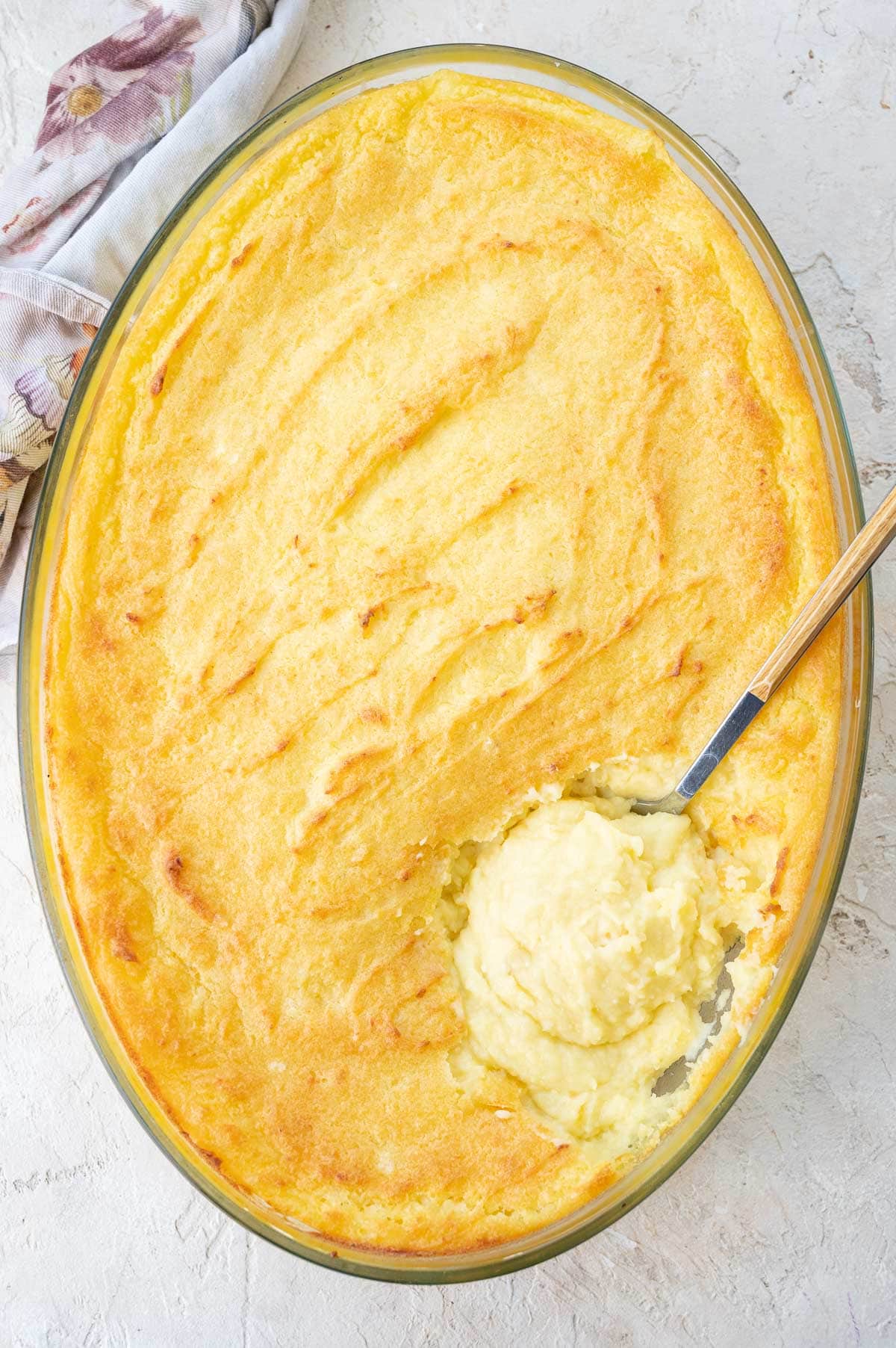 Make-ahead mashed potatoes in a large baking dish.