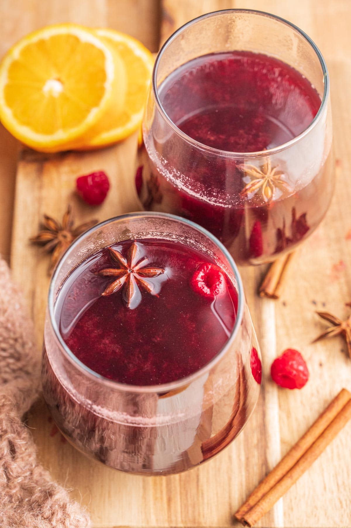 Two glassed with Polish mulled wine on a wooden board.