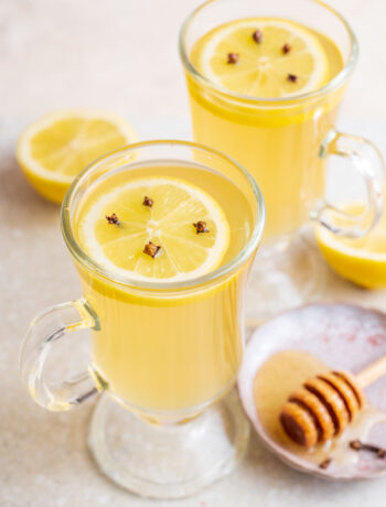 Two glasses with hot toddy cocktail.