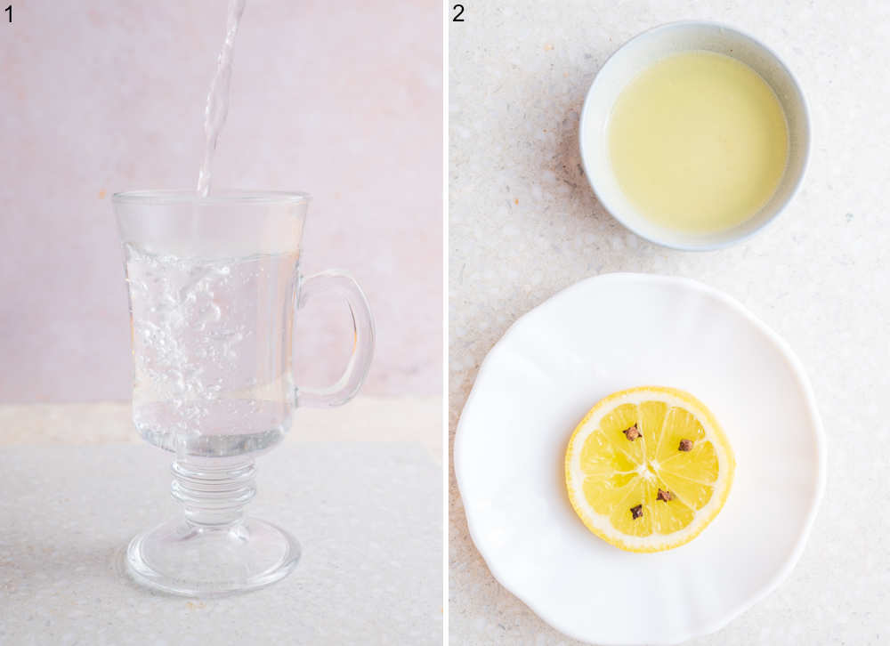 Boiling water is being poured into a cup. Lemon juice and lemon slice with cloves on a plate.