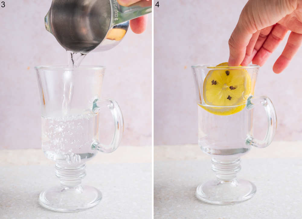 Hot water is being poured into a glass. Lemon slice with cloves is being added to a glass with hot water.