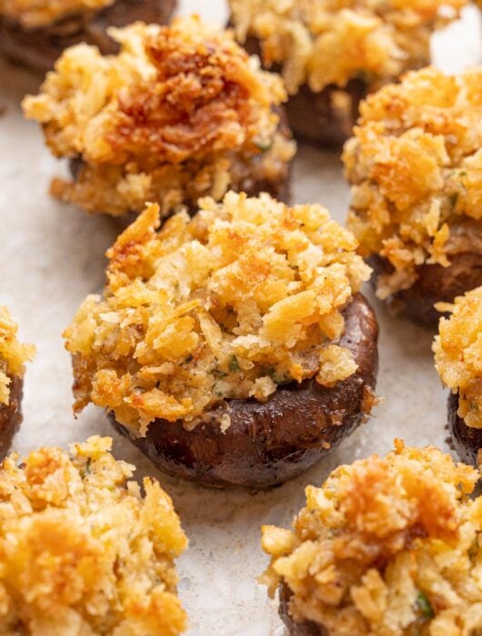 Stuffed mushrooms on a grey background.