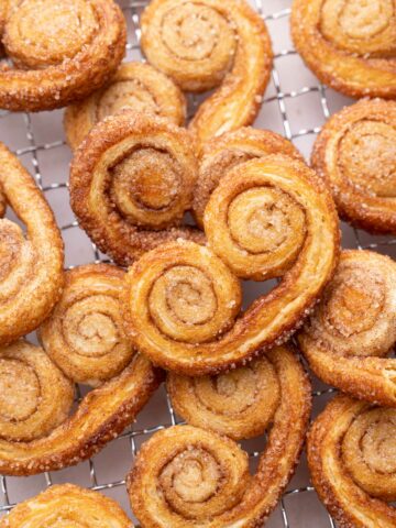 Palmiers cookies on a cooling rack.