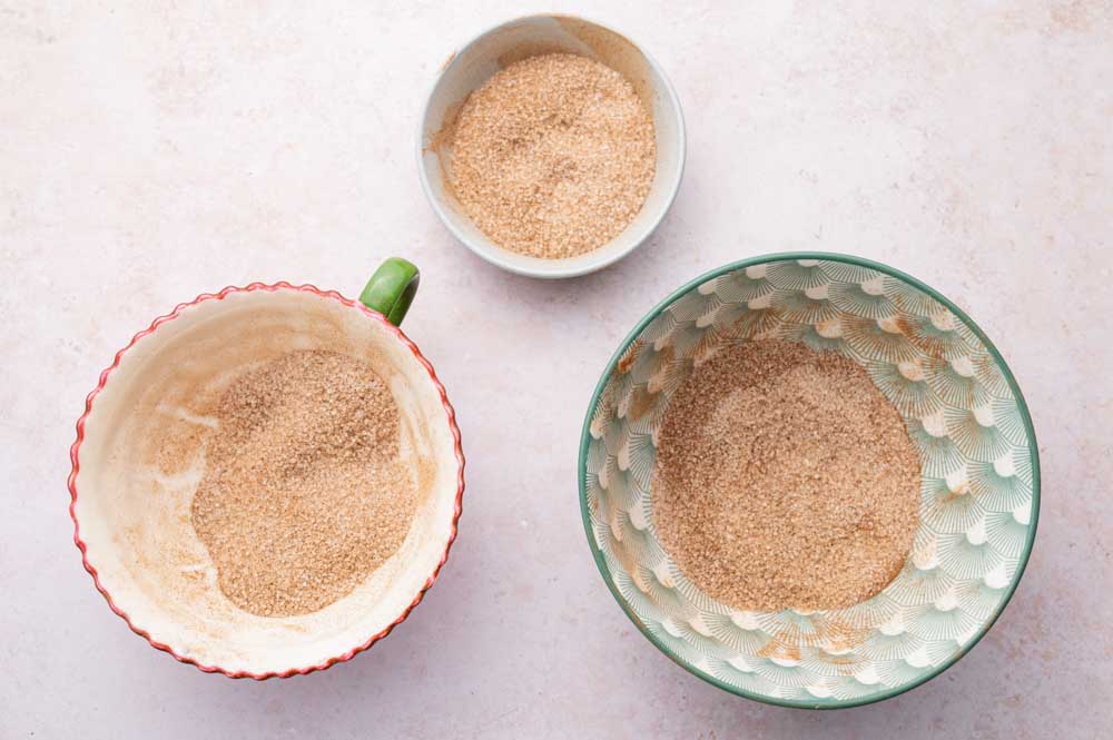 Three bowls with cinnamon sugar.