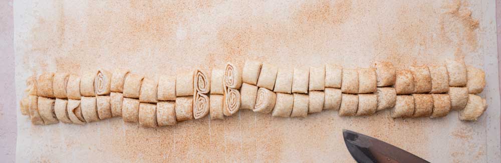 Puff pastry log cut into slices.