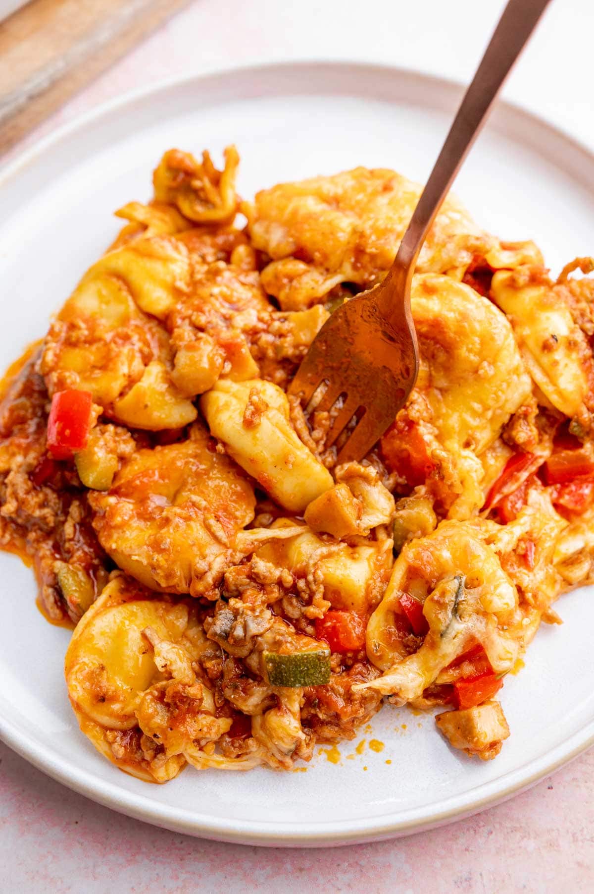 Tortellini bake on a white plate.