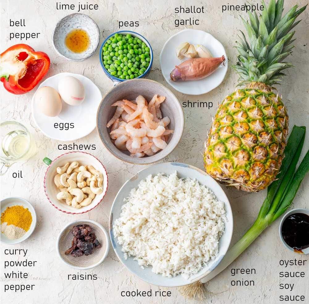 Labeled ingredients needed to prepare Pineapple Fried Rice.