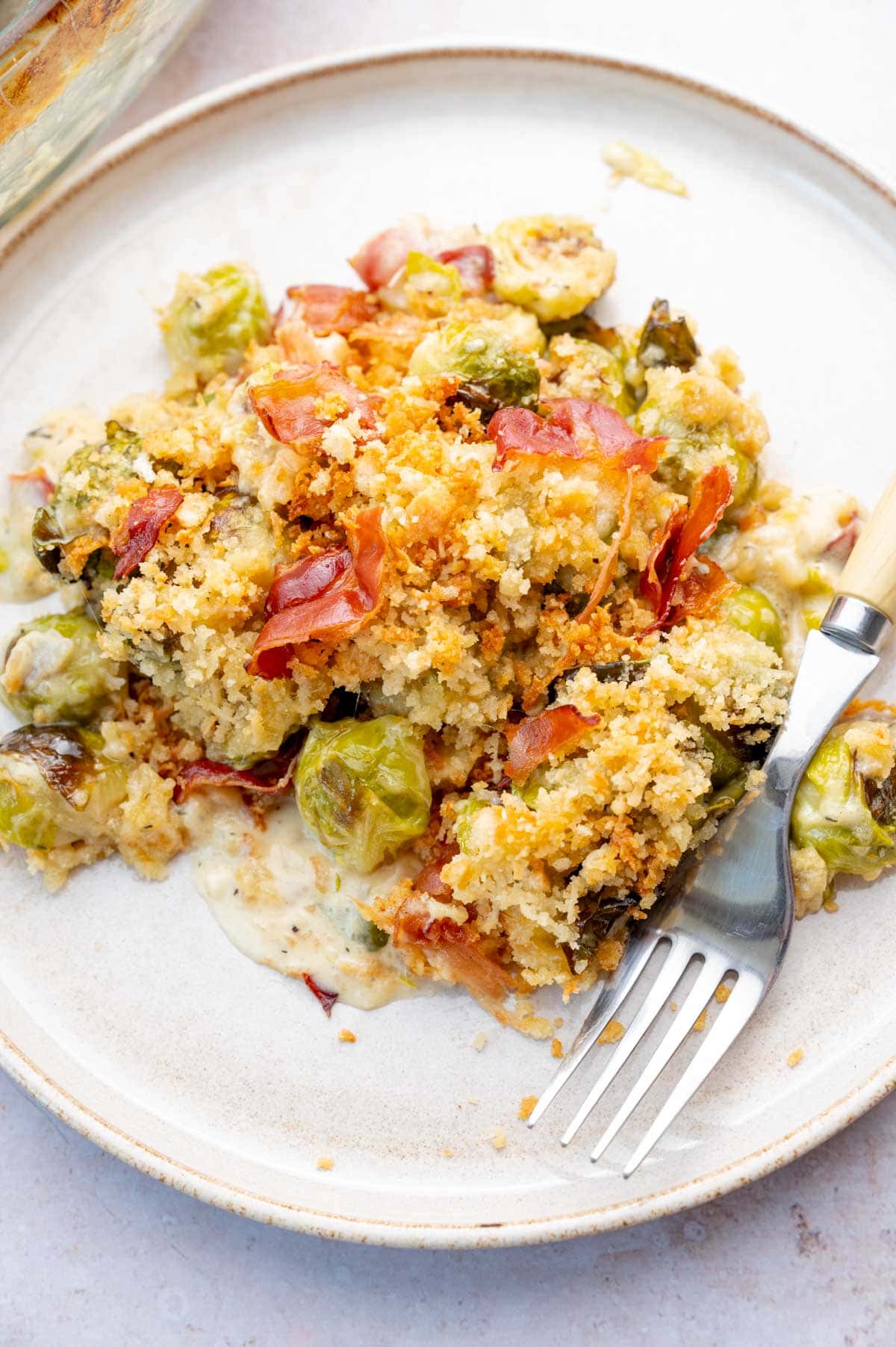 Brussels Sprouts Gratin on a white plate.