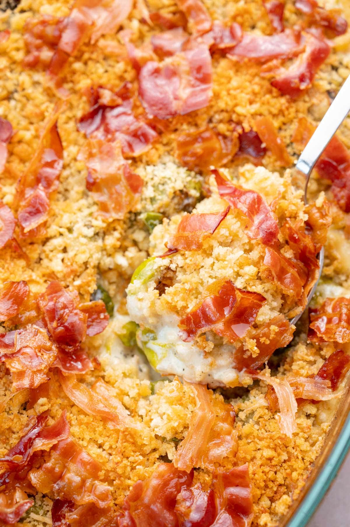 A close up photo of Brussels Sprouts Gratin in a baking dish.