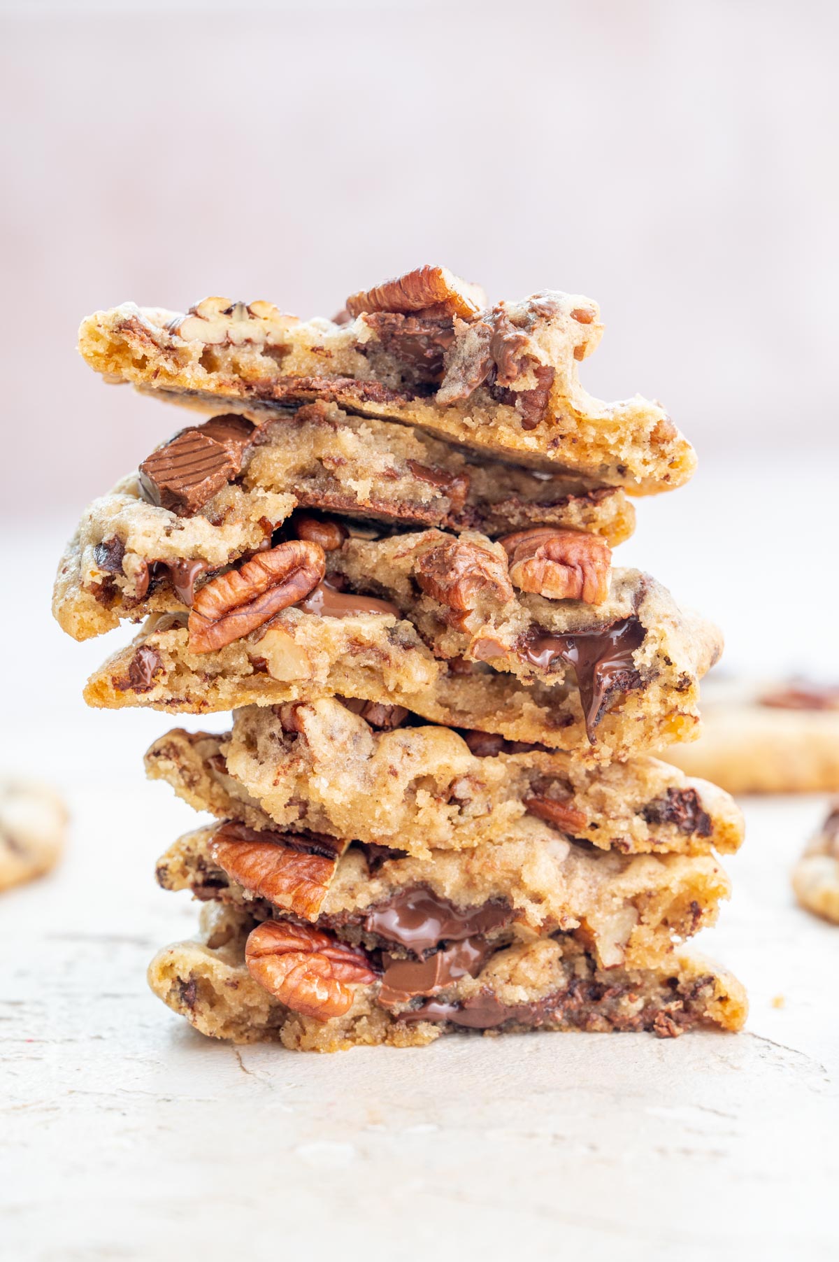 A stack of chocolate chip pecan cookies.