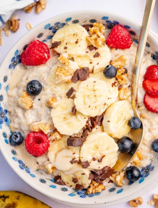 Banana oatmeal in a white bowl.