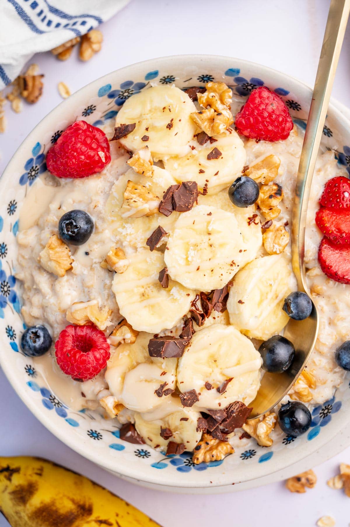 Banana oatmeal in a white bowl.