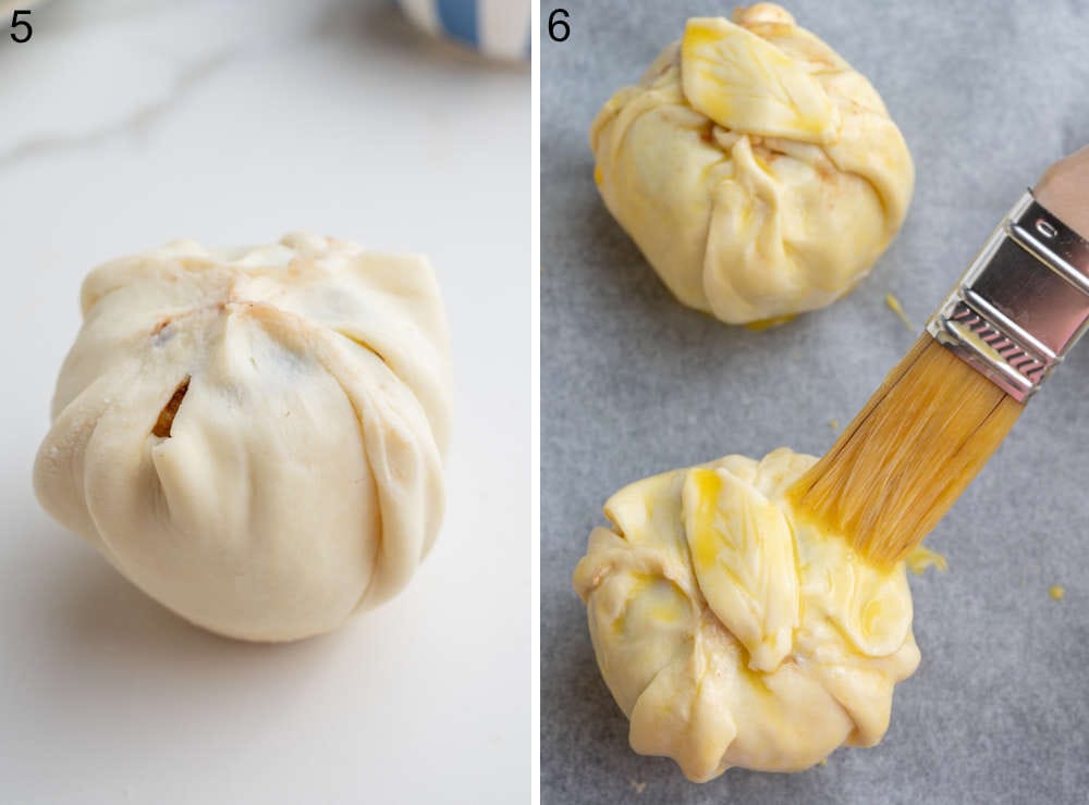 An apple wrapped in puff pastry. Apples in puff pastry are being brushed with egg wash.