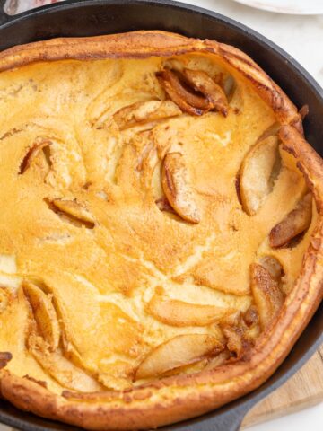 German apple pancake in a cast iron pan.