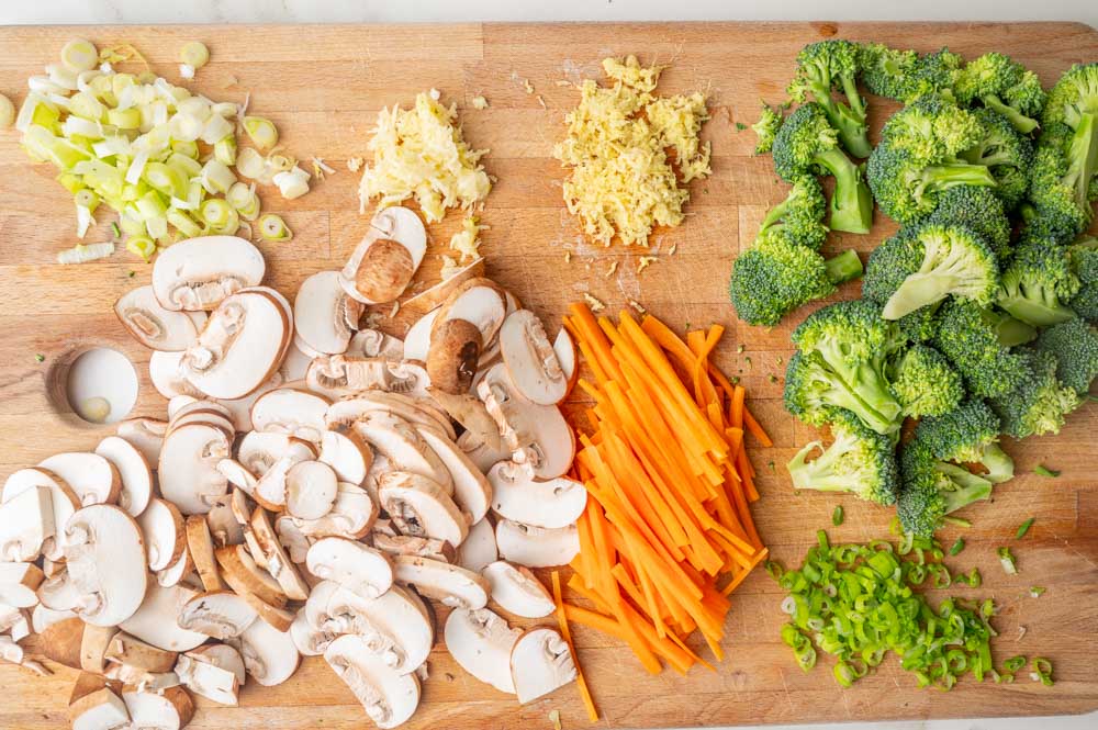 Chopped vegetables on a wooden board.