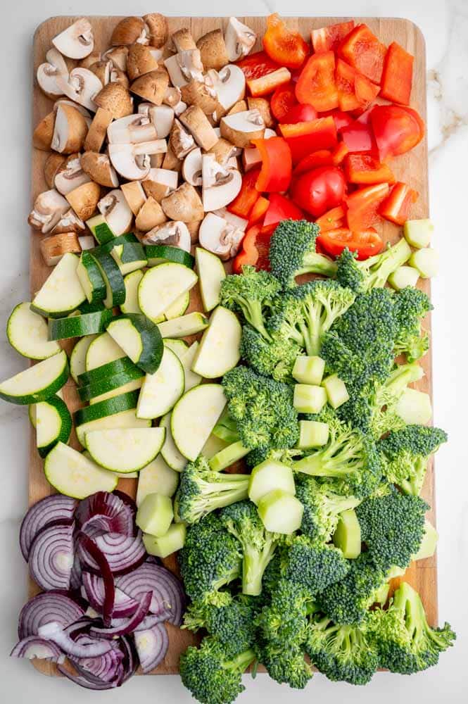 Chopped vegetables on a wooden board.