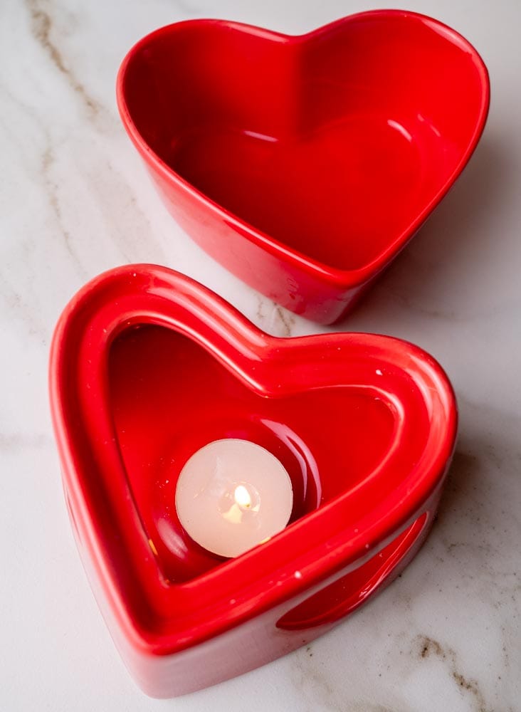 Heart-shaped red chocolate fondue bowl.