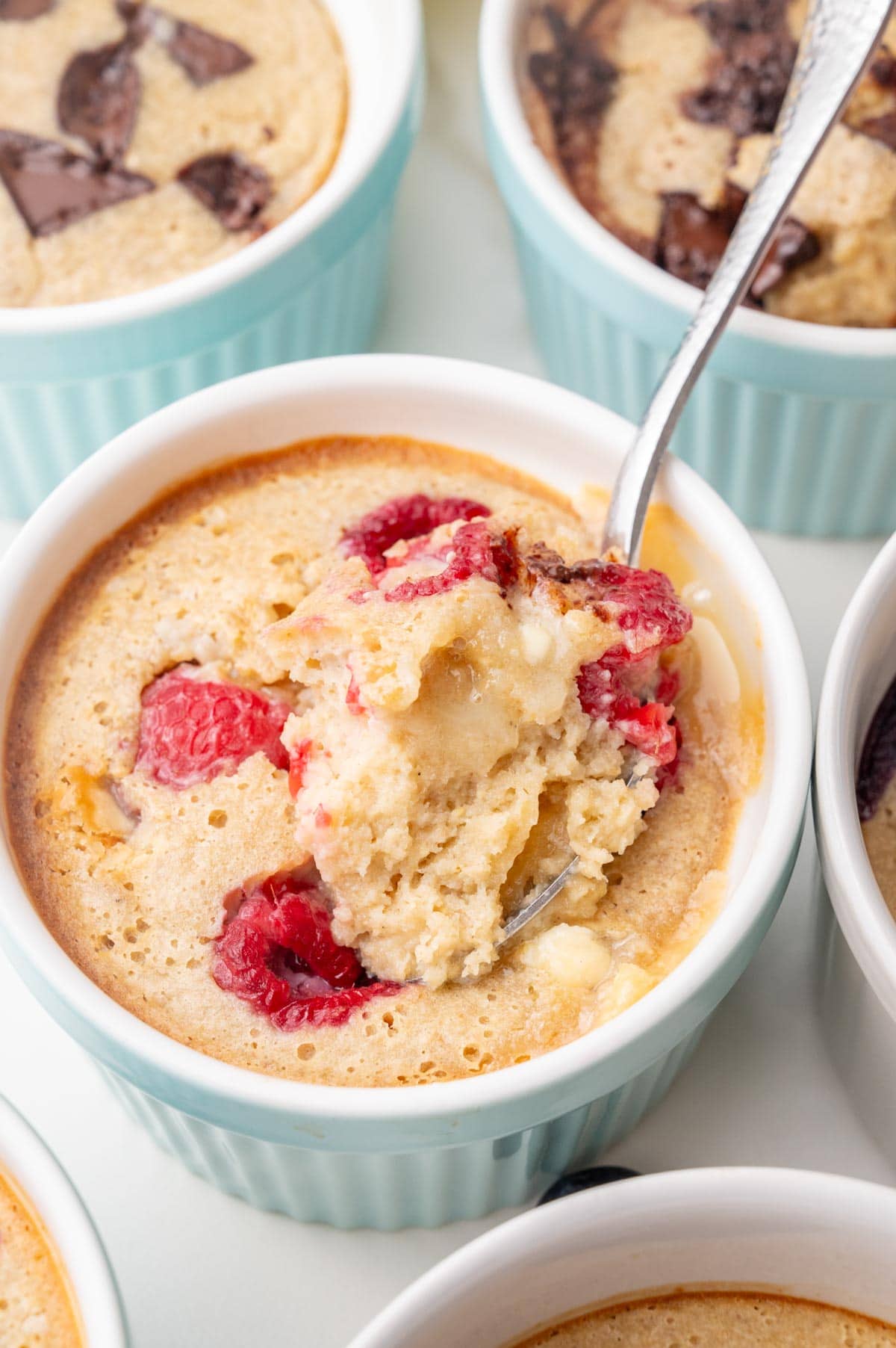 White chocolate raspberry baked oats in a small ramekin.