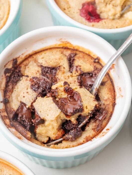 Chocolate chip baked oats in a smal lblue ramekin.